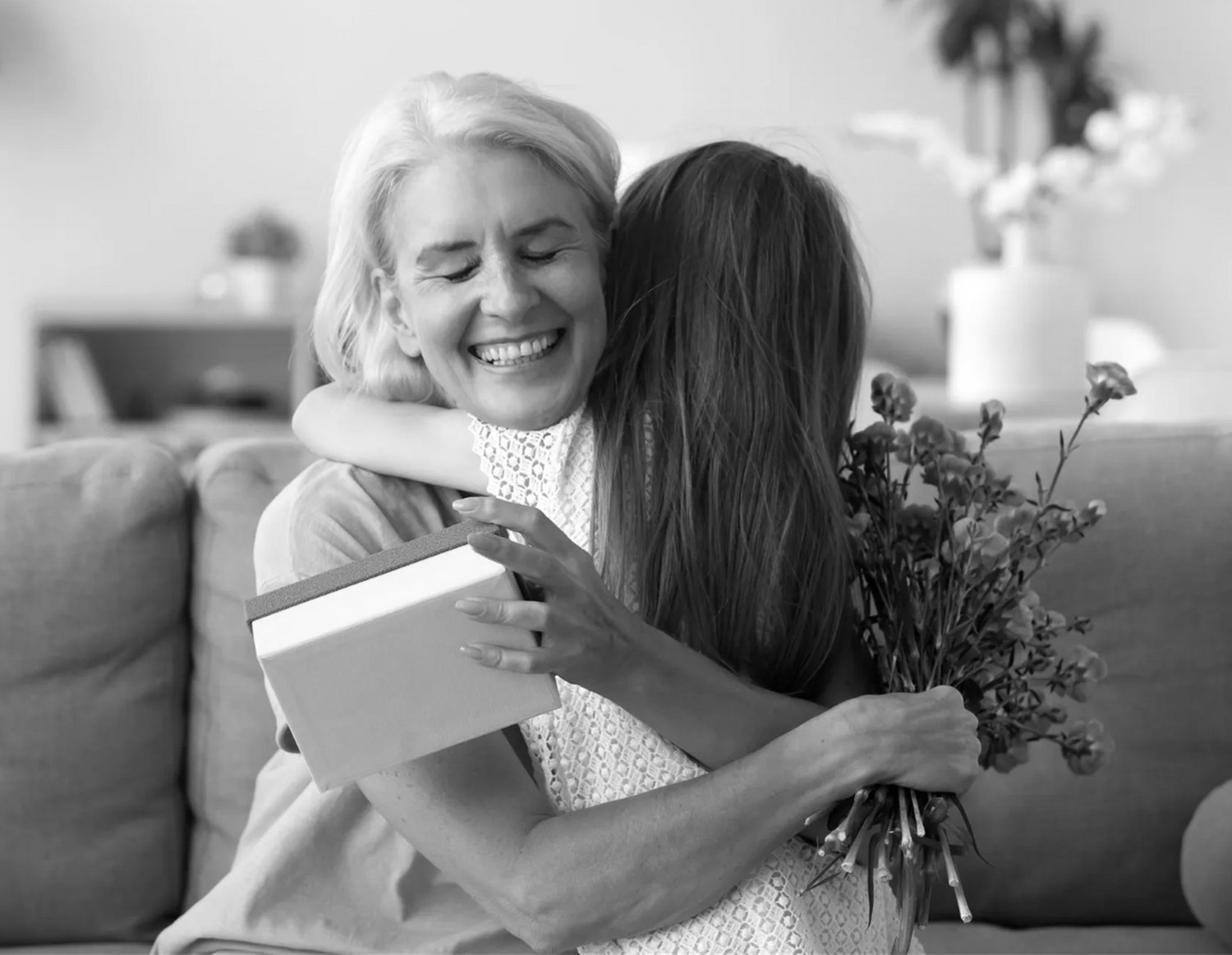 photo of grandma receiving a gift from granddaughter